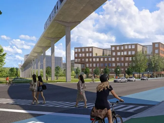 A rendering of people walking and biking underneath a monorail track on campus