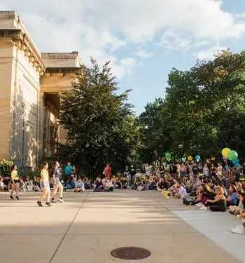 An outdoor performance and celebration at UMMA