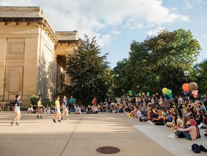 An outdoor performance and celebration at UMMA